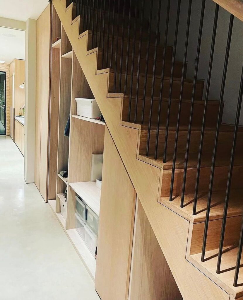 Custom plywood joinery and integrated staircase storage at the Wandle Road residential project in Wandsworth SW17
