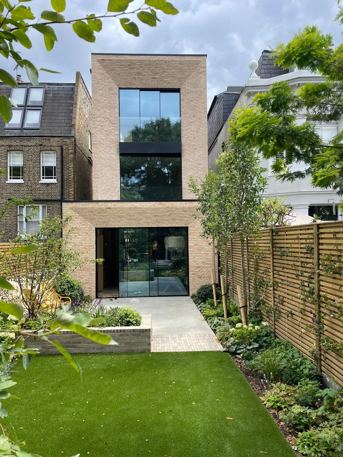 Landscaped garden and contemporary residential architecture creating a strong connection between external and internal spaces