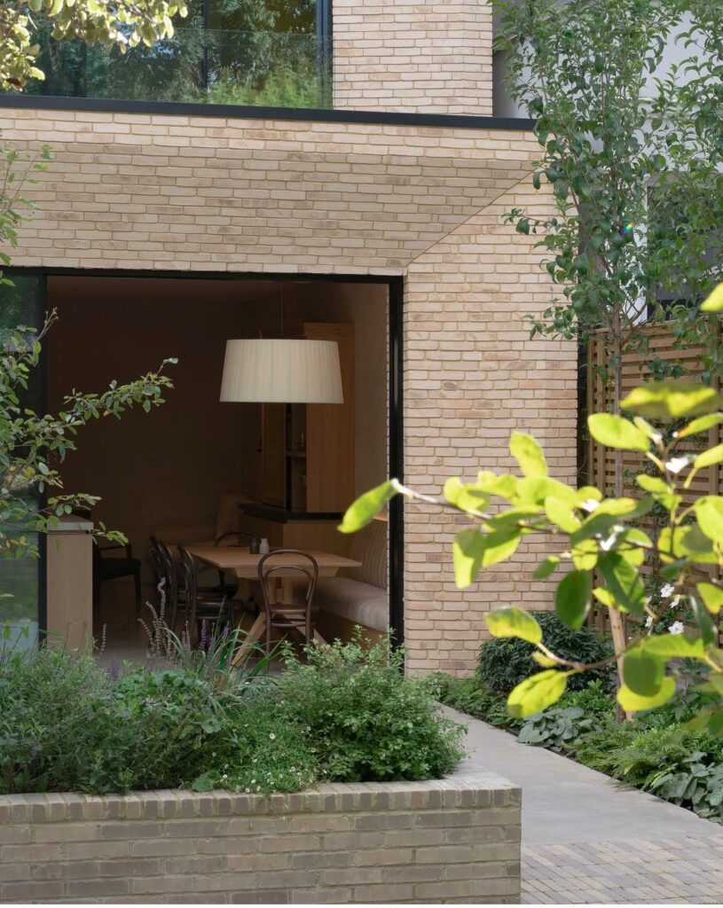 Contemporary residential extension with landscaped garden and open-plan living space at Wandle Road, Wandsworth SW17